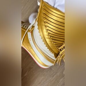 CHRISTIAN LOUBOUTIN GOLD LEATHER HIGH TOP SNEAKER 8.5 MEN AND 9.5 WOMEN.